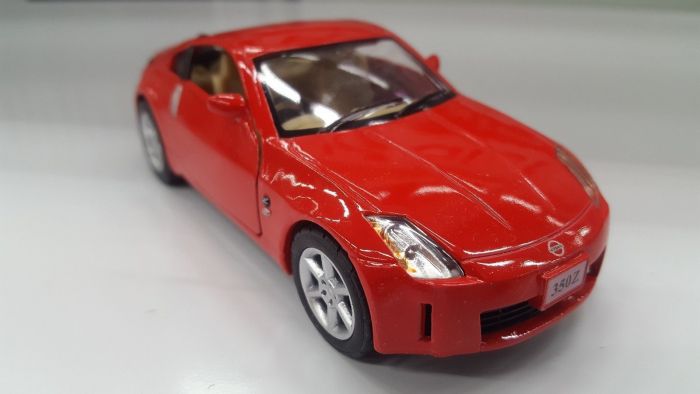 Дитяча іграшка машинка металева Nissan 350Z KT 5061 W Kinsmart метало - пластиковий корпус, відчиняються двері