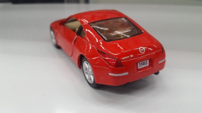 Дитяча іграшка машинка металева Nissan 350Z KT 5061 W Kinsmart метало - пластиковий корпус, відчиняються двері